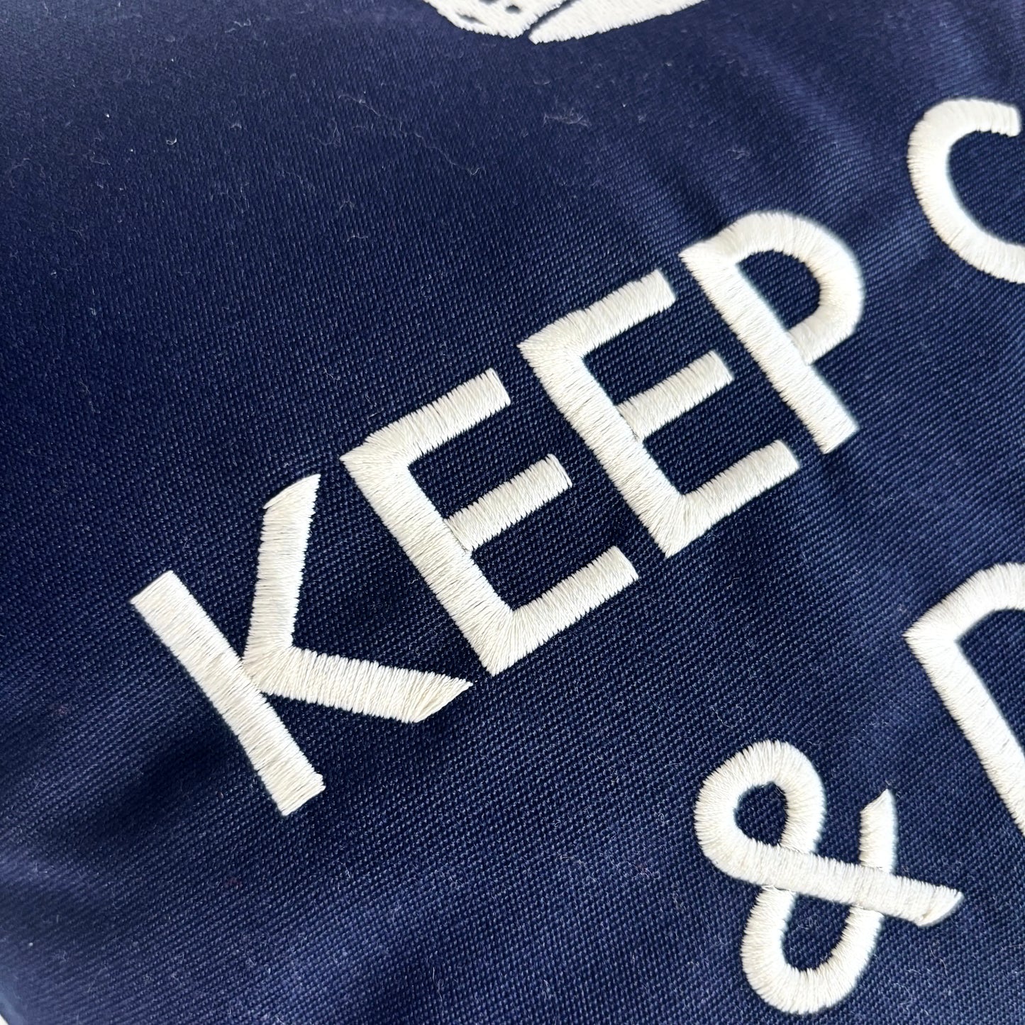 Decorative cushion “Keep Calm & Drink Champagne” – Navy blue with white embroidery