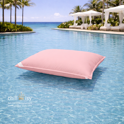 Premium Poolkissen Maxi 190x130 cm von chillisy in Rosa im Pool mit Meeranschluss treibend.