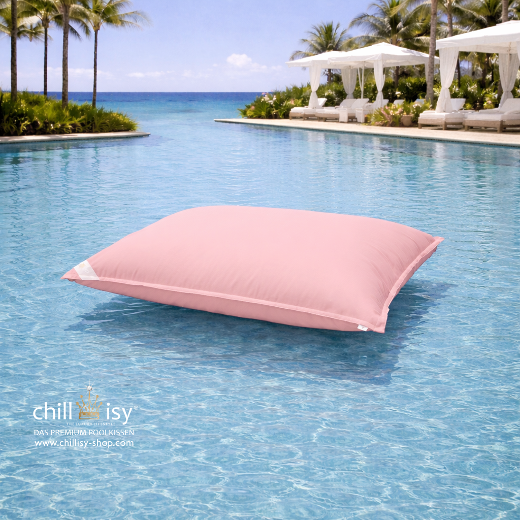 Premium Poolkissen Maxi 190x130 cm von chillisy in Rosa rose im Pool mit Meeranschluss treibend.