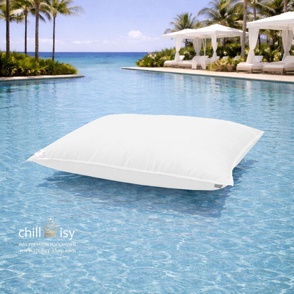 Premium Poolkissen Maxi 190x130 cm von chillisy in Weiß im Pool mit Meeranschluss treibend.